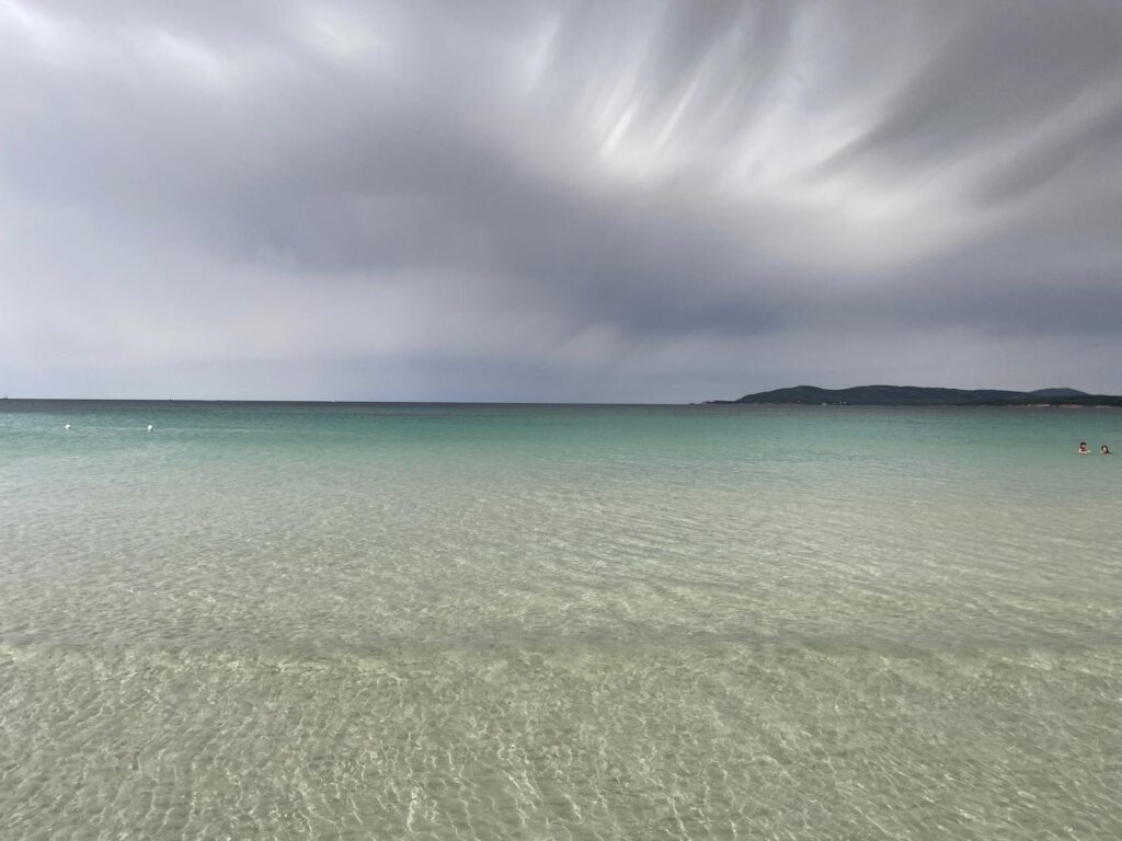 Maria Pia Beach Alghero with pine forest and shallow sea